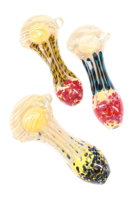 4-inch silver-fumed color-changing glass hand pipe with multicolor stripes, frit mouthpiece, and small marble accent, shown in assorted colors.