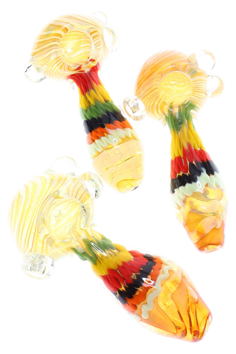 4–5″ gold-fumed color-changing glass spoon pipe with Rasta squiggle stripes on the stem and clear marble roll-stops around the bowl.
