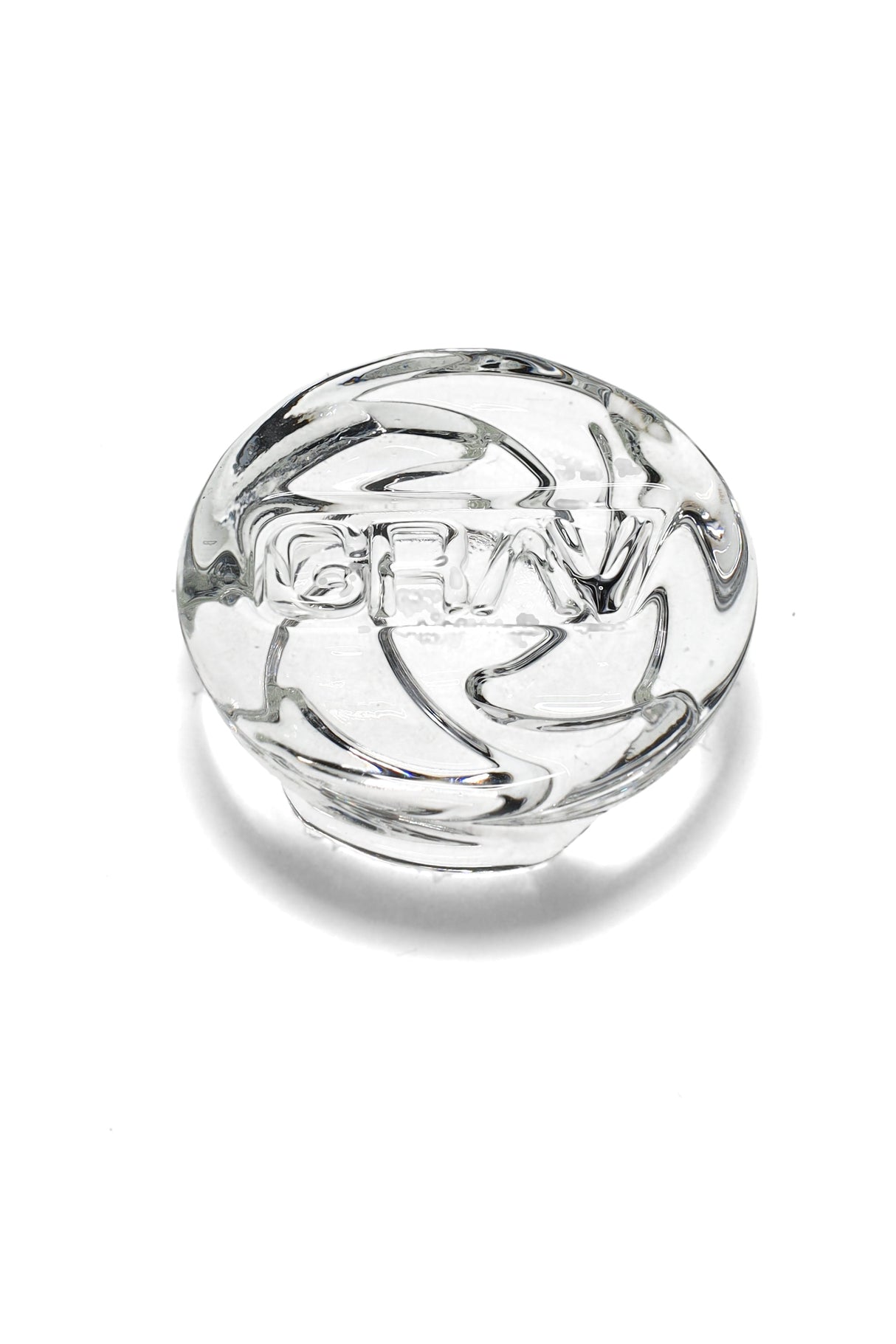Clear GRAV spinner carb cap with puck-shaped top and triple-channel directional airflow grooves, designed for bucket bangers.