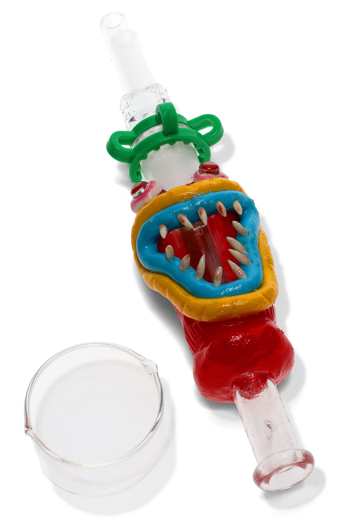 Multicolor monster glass dab straw kit with wide open mouth and teeth, green keck clip and clear dish for dabs.