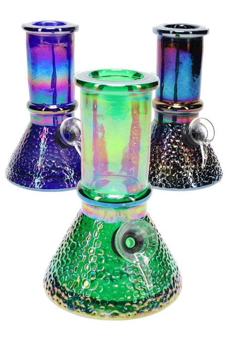 Assorted-color 5.5-inch metallic mini beaker bong with dimpled bubble base, reflective chrome-rainbow finish, and grommet bowl displayed on white background.