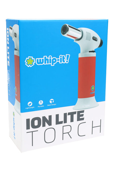 Ion Lite torch white body with red grip on box; compact dab torch with polished nozzle, slightly left-facing.
