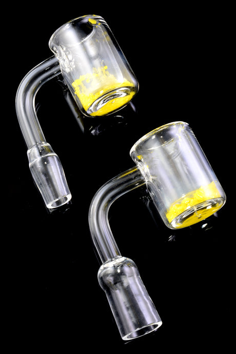 Thermochromic quartz banger pair with 14.5 mm male joints and 90° necks; color-changing base highlights heat level.