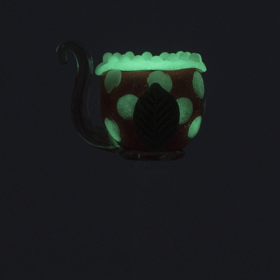 Glow-in-the-dark piranha glass bowl showing lit rim and dots, sized for 14.5 mm bong joints.