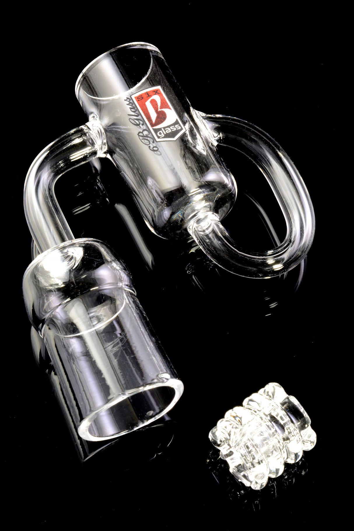 Close-up of 6B Glass terpcycler recycler banger on black background with included gear insert for smooth spinning dabs.