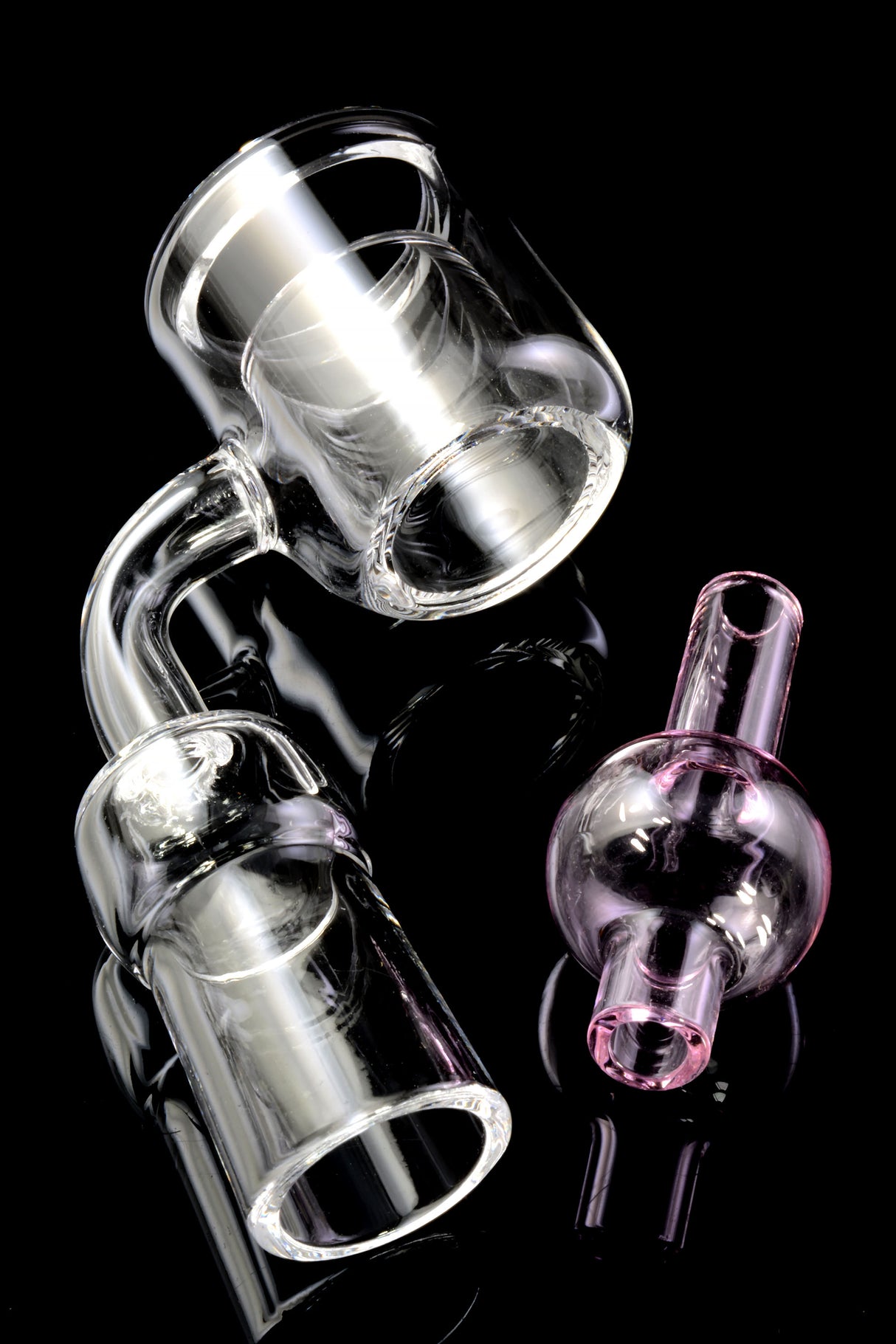 Side view of flat-top thermal quartz banger with 14.5 mm joint and pink bubble carb cap on black background.