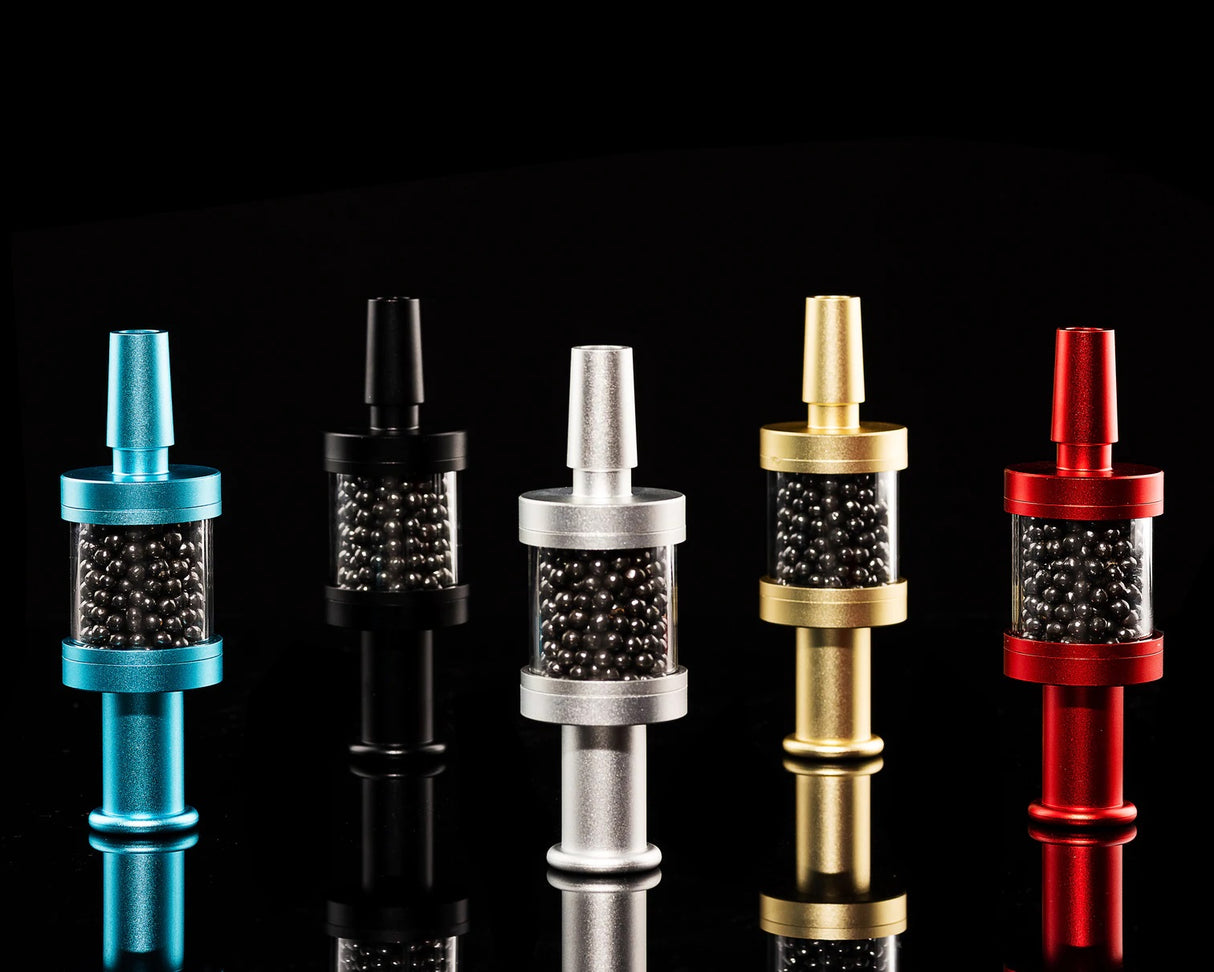 Assorted Flux Pike tar filters in blue, black, silver, gold, and red, carbon bead chambers displayed, 14 mm attachments.