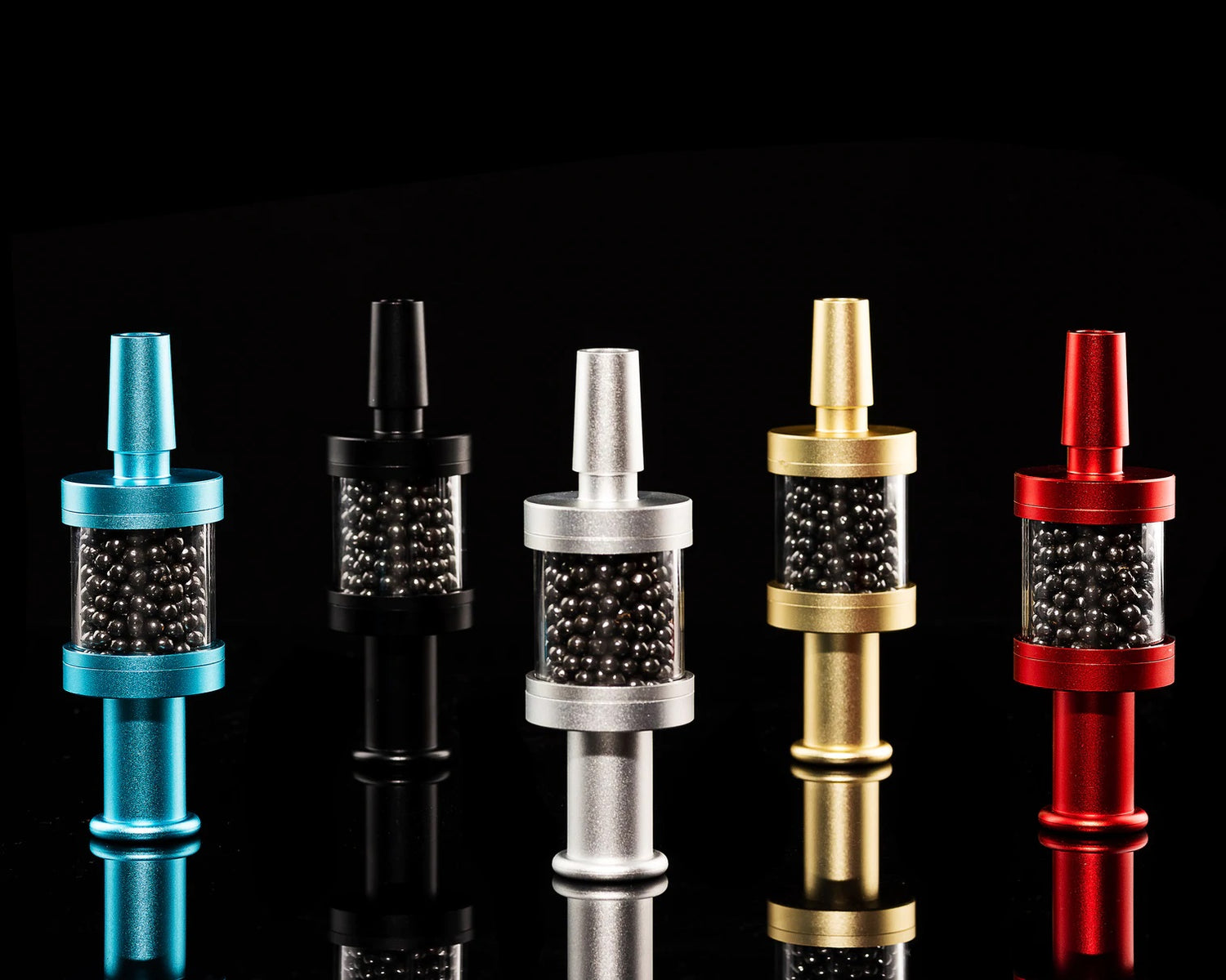 Assorted Flux Pike tar filters in blue, black, silver, gold, and red, carbon bead chambers displayed, 14 mm attachments.