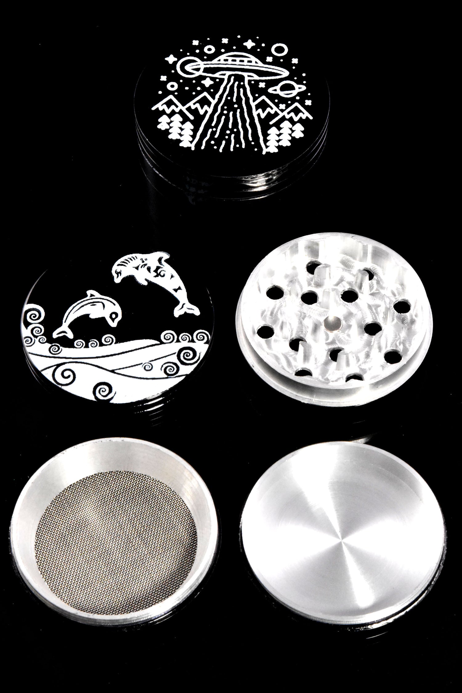 Four-piece black aluminum herb grinder disassembled to show diamond-style teeth, kief screen, and pollen catcher components.
