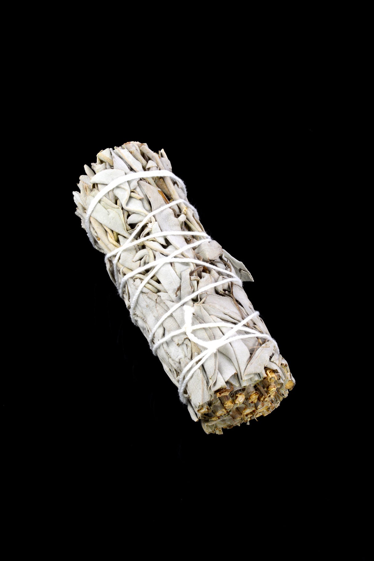 4-inch California white sage bundle wrapped in cotton twine on black background, perfect for cleansing smoke rituals.
