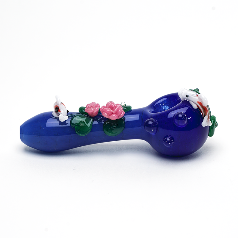 Side profile of koi pond spoon pipe with blue glass body, raised pink blossoms, and clear marble grips
