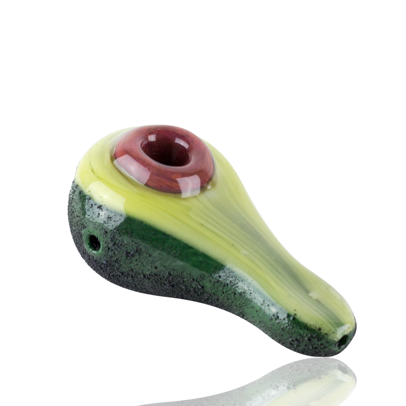 Top view of 4½″ avocado hand pipe with black background, pit-style bowl, and speckled rind texture