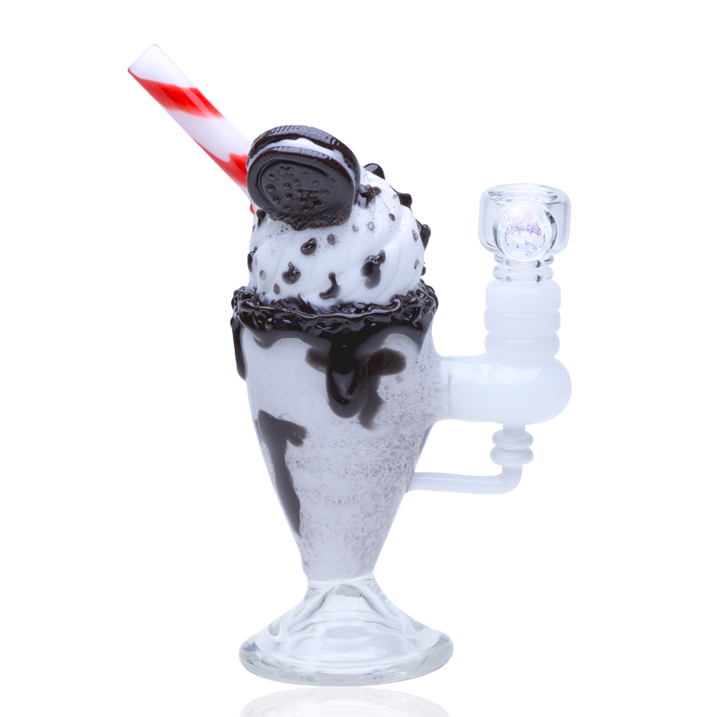 Dessert-themed glass mini rig resembling a chocolate cookie sundae float, compact pedestal base with glass joint and sculpted details.