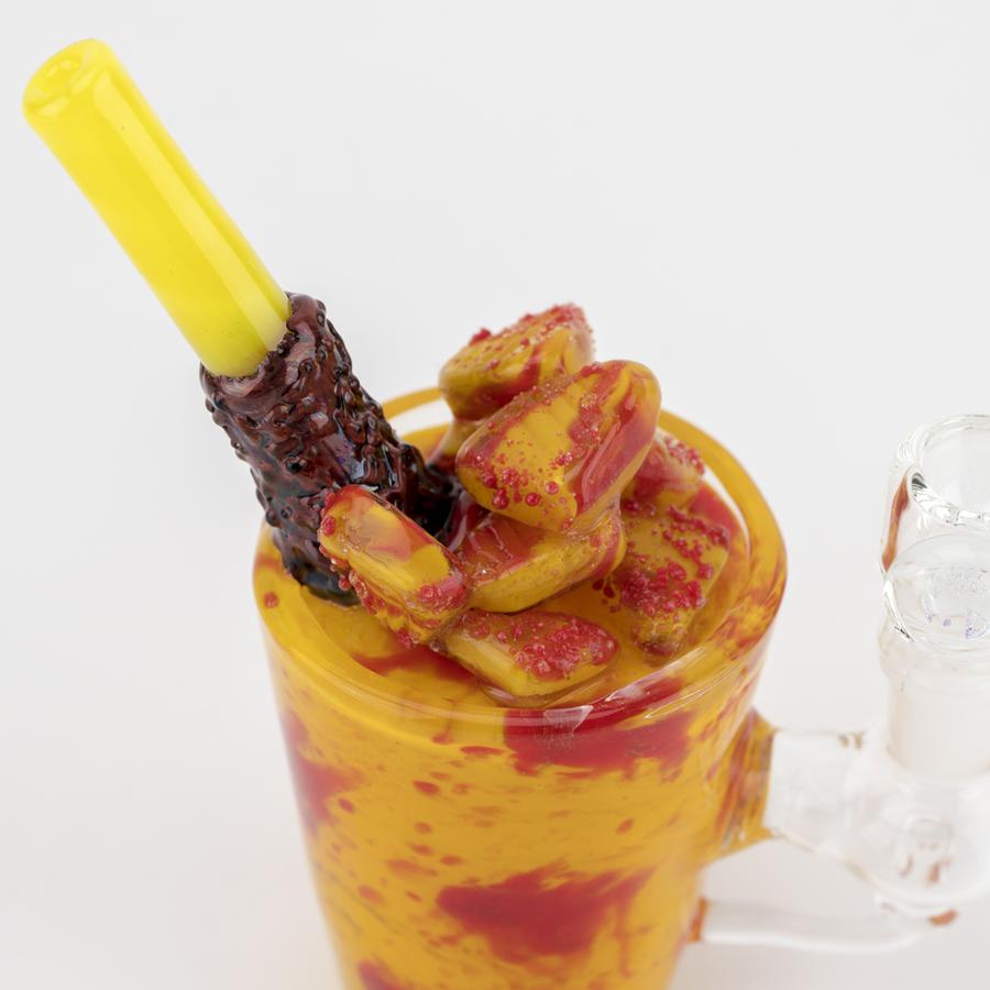 Overhead closeup of fruit-topped cup showing straw mouthpiece and recessed 14.5 mm joint opening.