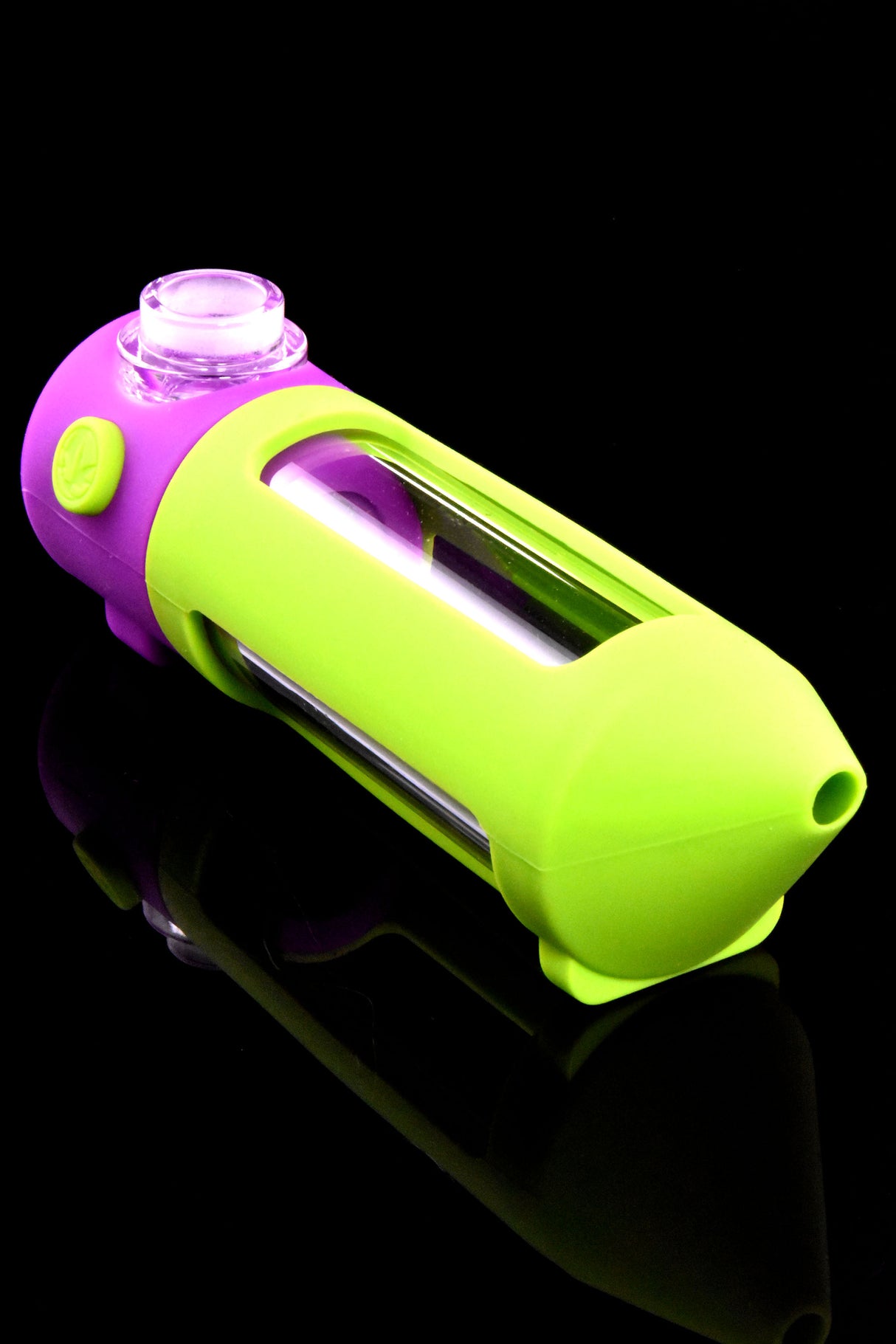 Close view of green-and-purple modular mini water pipe with glass chamber visible through side window.