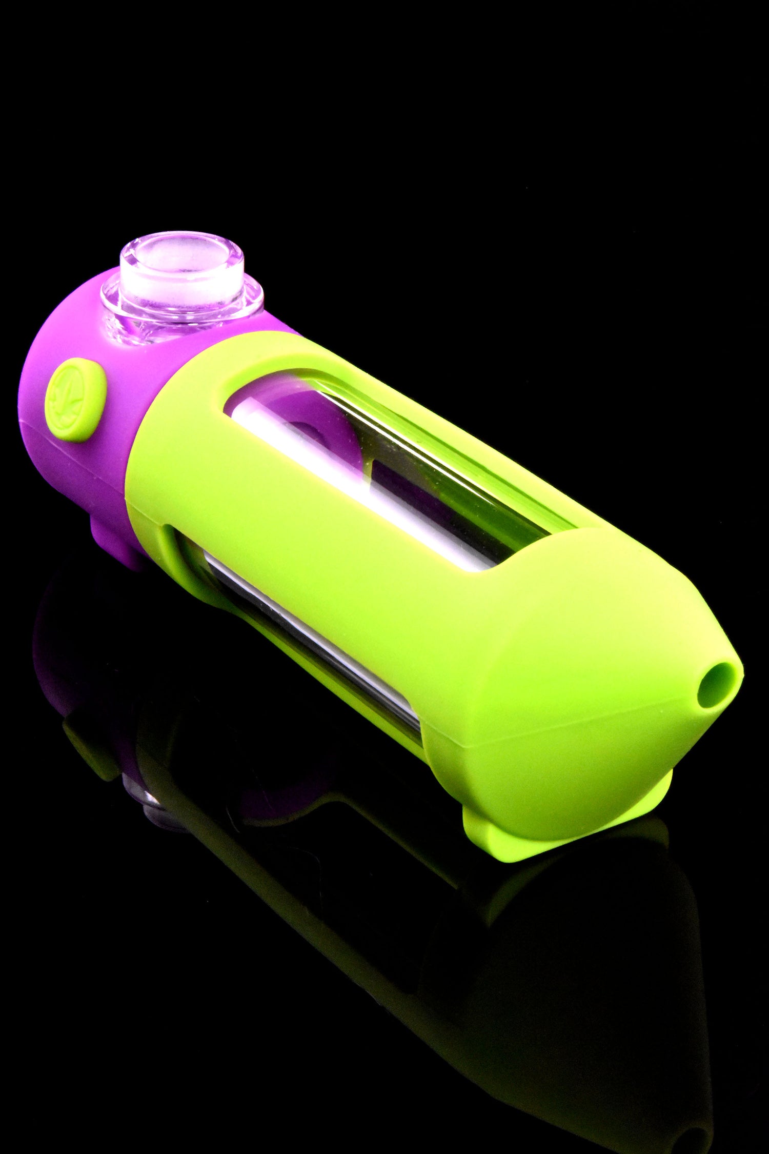 Close view of green-and-purple modular mini water pipe with glass chamber visible through side window.