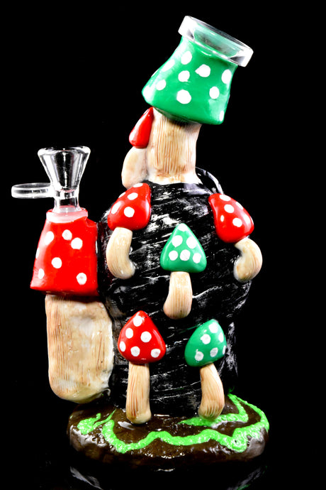 Rear angle of mushroom glass water pipe on black background with multiple dotted caps and sturdy sculpted base.