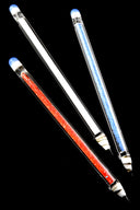 Trio of 6-inch glass pencil dab tools with red, clear, and blue frit cores and pointed tips, displayed on black background for color contrast.