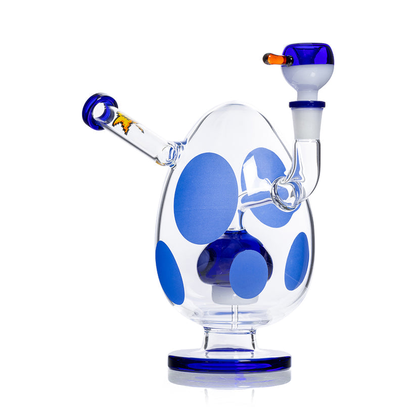 Side view of blue-accent Hemper Spotted Egg XL bong showing egg-shaped chamber, pedestal base and flared mouthpiece arm.