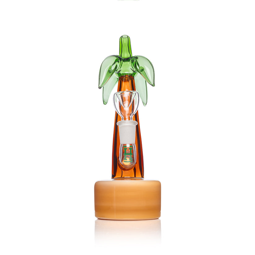 Straight-on shot of Hemper Palm Tree glass bong showing tall amber trunk, green leaf mouthpiece and centered 14.5 mm joint.