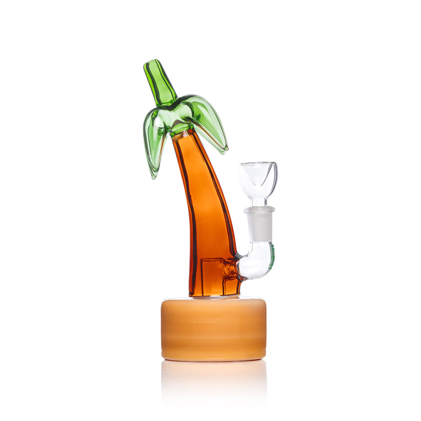 Side profile of Hemper Palm Tree mini glass bong highlighting curved trunk, sand-tone base and clear slide bowl connection.