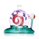 Profile shot of teal-base Snail XL glass bong with pink dome shell, purple spots and raised eyeball stem, isolated on white for product display.