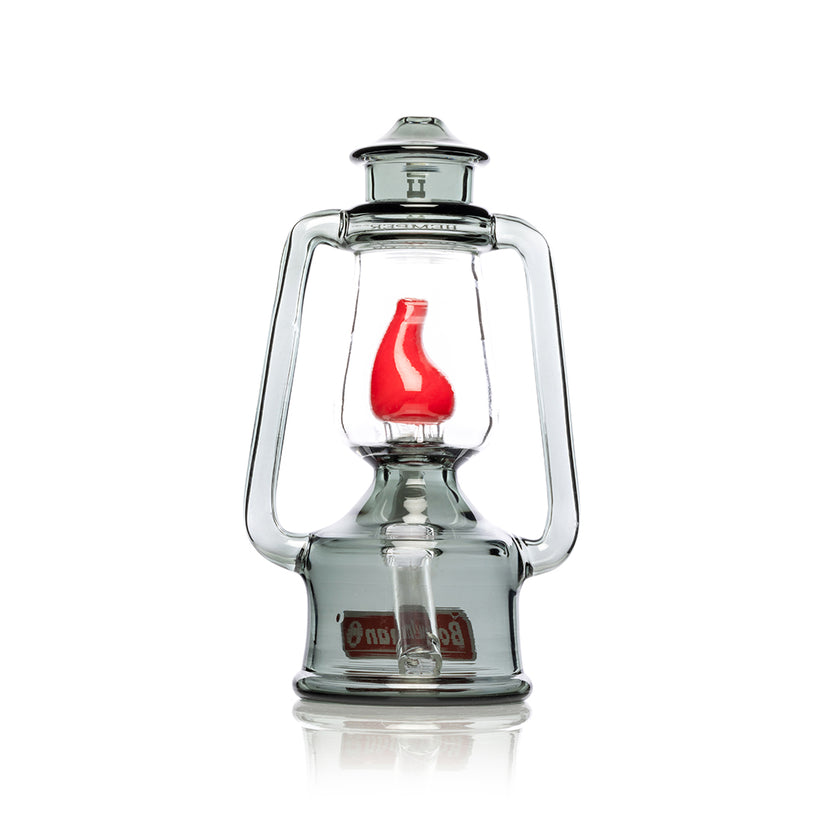 Straight-on rear view of Hemper Bowlman Lantern 7-inch smoke glass bong showcasing clear inner globe and sculpted red flame perc.