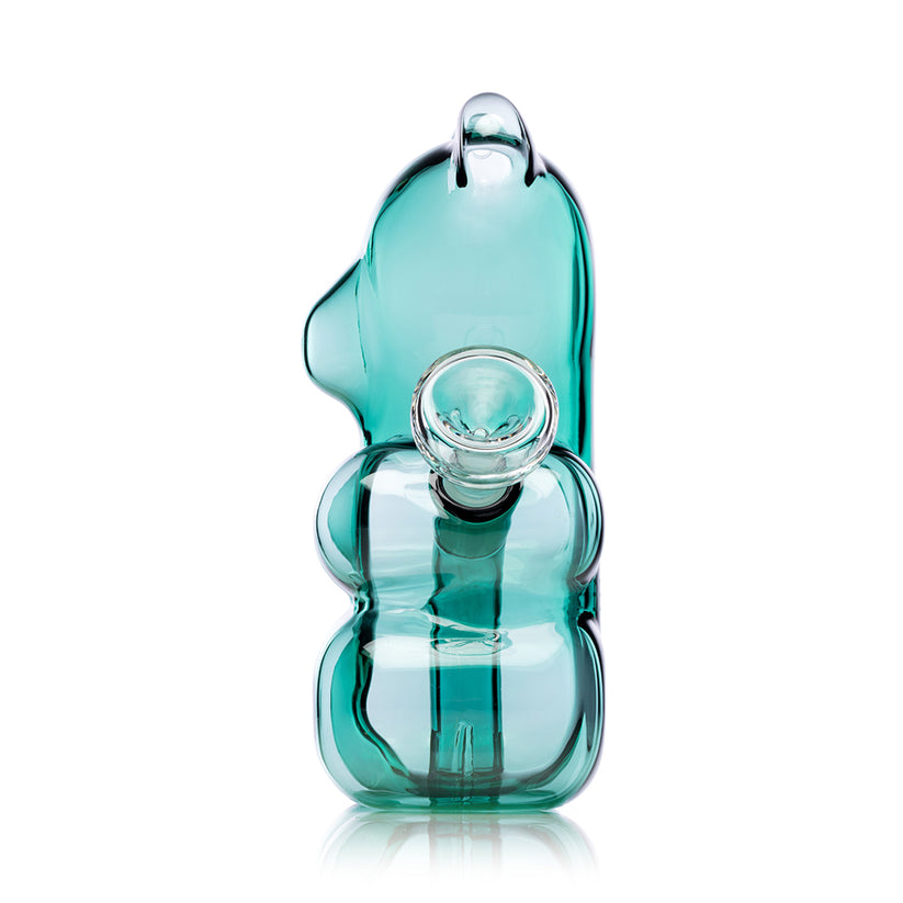 Side profile of teal 6.5″ Gummy Bear glass bong with forward-facing joint, ear mouthpiece and visible perc chamber on white.