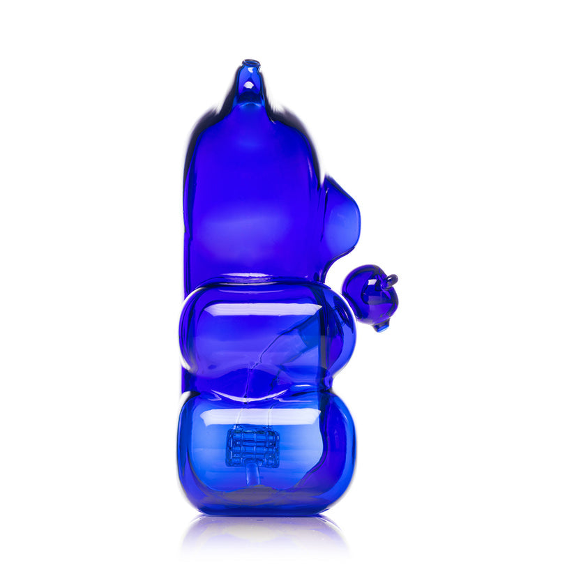 Profile view of Hemper Gummy Bear XL blue glass water pipe, tall gummy bear silhouette with ear mouthpiece and internal perc.