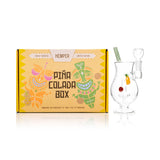 Front view of 6-inch Hemper Pina Colada water pipe with showerhead perc, pineapple and cherry garnishes inside chamber.