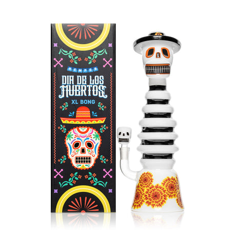 Front view Hemper Dia De Los Muertos XL skeleton glass bong and box, showing sugar-skull face and bold marigold flower base.