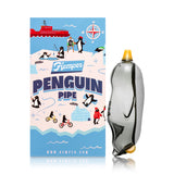 Upright smoky gray Hemper Penguin 4″ glass hand pipe standing beside illustrated Penguin Pipe packaging for retail display.