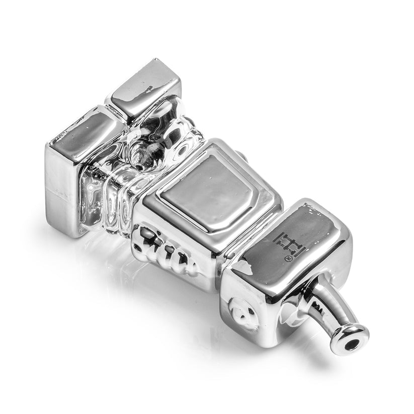 Hemper Hi-Robot chrome glass hand pipe lying on its back to show bowl placement, carb hole and detailed robot body sculpting.