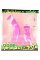 Ooze Steamboat silicone glass bubbler dab rig in pink and white swirl, retail packaging showing included 14 mm accessories.