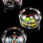 Set of pop-art skull design tempered glass ashtrays, staggered layout showcasing full print detail on black backdrop.