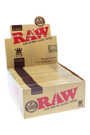 Counter display box of RAW King Size Slim rolling papers—50 booklets of unbleached kraft paper with vegan gum and the classic red RAW logo.