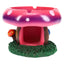 Hand-painted pink and purple mushroom-house resin ashtray with grassy base and two rest notches, compact 4-inch tabletop size.