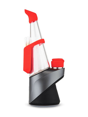 Red kit on Puffco Peak Pro showing silicone mouthpiece, backpack, chamber jacket with tether, and Oculus carb cap.