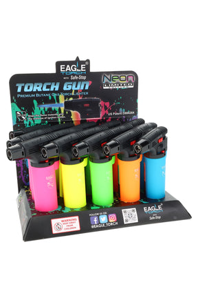 15-pack Eagle neon torch gun lighters in counter display with Safe-Stop flame lock system; assorted colors shown, angle.