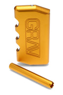 Compact 3.75-inch GRAV aluminum dugout with twist lid, polycarbonate stash window, spring-loaded aluminum taster, and recessed poker; gold color shown.