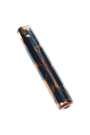 Black ceramic one-hitter bat with copper-gold marbling and glossy glaze, slim chillum tube.