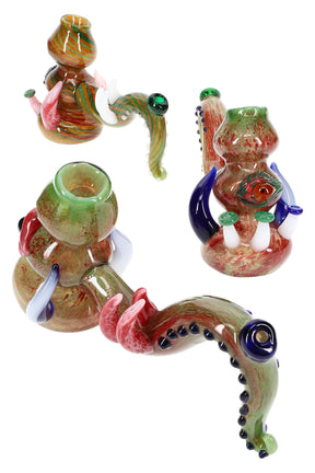 Assorted silver-fumed glass hammer bubblers with tentacle necks, eyeball and mushroom accents, about 8″ long each on white background.