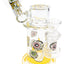 Yellow-accent eyeball sidecar glass bong with GoG joint and stable puck base, featuring dripping eye artwork, 5.5″.