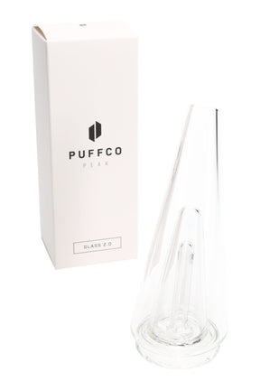 Clear Puffco Peak Glass 2.0 replacement top shown beside retail box, tapered cone body with internal downstem for water filtration.
