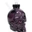 Black skull glass bong against white background, top-down view focusing on airtight cap and slide
