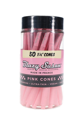 Clear jar of 50 Blazy Susan 1¼-inch pink pre-rolled cones with black screw-top lid and branded label, studio front view showcasing contents.