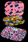 Small silicone rolling tray with flag collage and bold graphics, 8″ × 6″; curved rim helps corral papers and accessories.