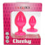 Cheeky two-piece silicone anal plug set in bright pink, each with a suction-cup base, displayed in retail box highlighting waterproof silicone.