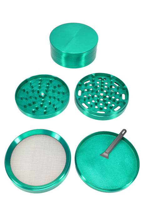 Green 100 mm 4-part zinc alloy herb grinder fully assembled, glossy finish and compact profile.