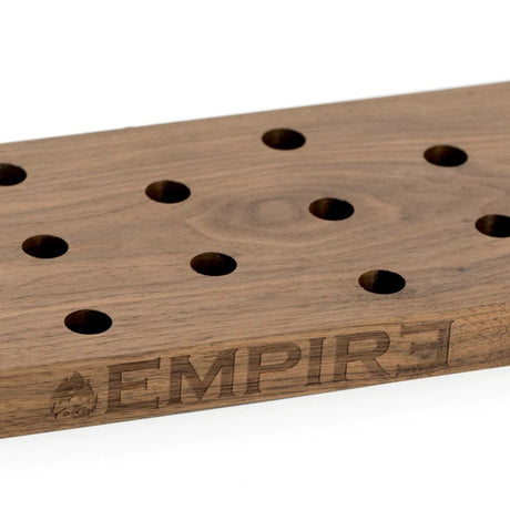 Close-up of Empire wooden bowl display with laser-etched logo and rows of 14.5 mm female sockets